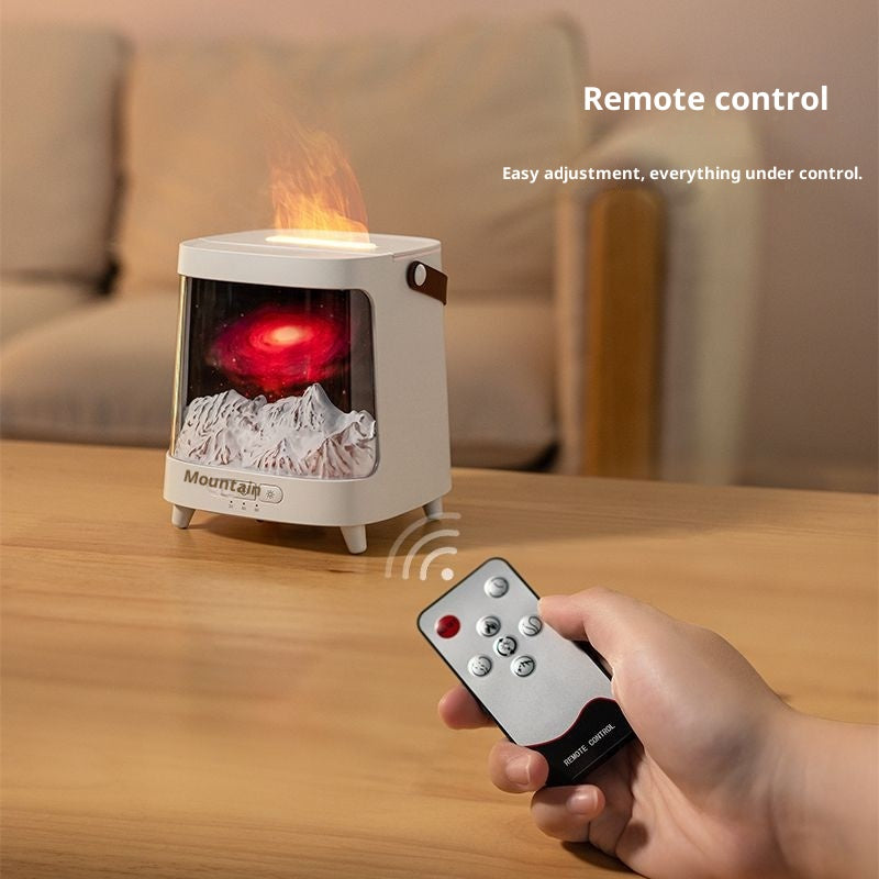 Tabletop fireplace with remote control on a wooden surface, blurred sofa in the background