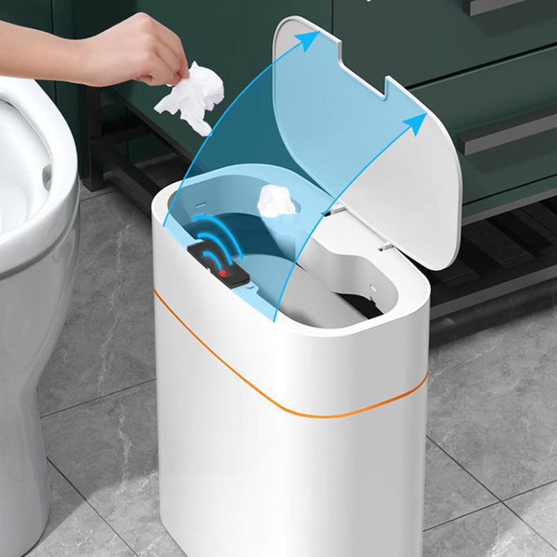 White trash bin with blue interior being used in a bathroom setting