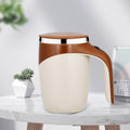 White mug with brown handle and lid on a marble surface